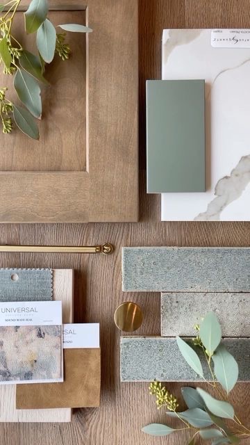 Interior design material palette with wood, stone, fabric, and brass samples